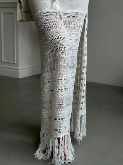 Solara Maxi Dress by Lauven featuring airy knit detailing, side slit elegance, and fringe hem movement.