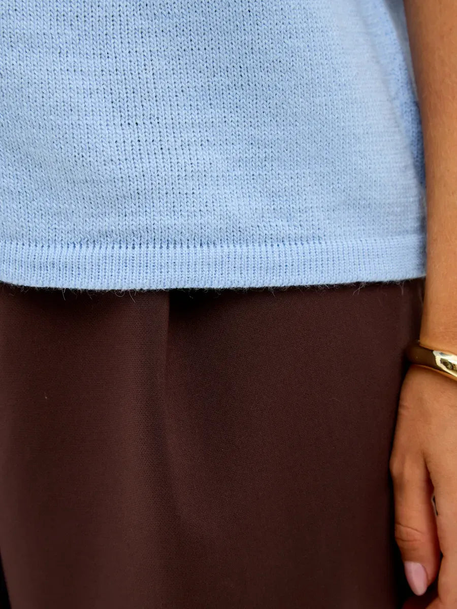 Alba Cardigan by Lauven, showing lightweight blue wool blend fabric and a relaxed fit.