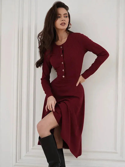 Crimson Grace Midi Dress in burgundy with gold buttons, long sleeves, and ribbed texture, styled elegantly.