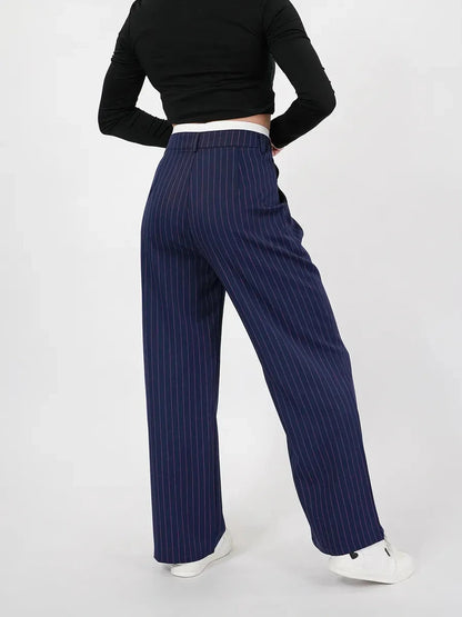 Aster Pants by Lauven featuring a high-waist, wide-leg silhouette in navy with pinstripes, perfect for stylish looks.
