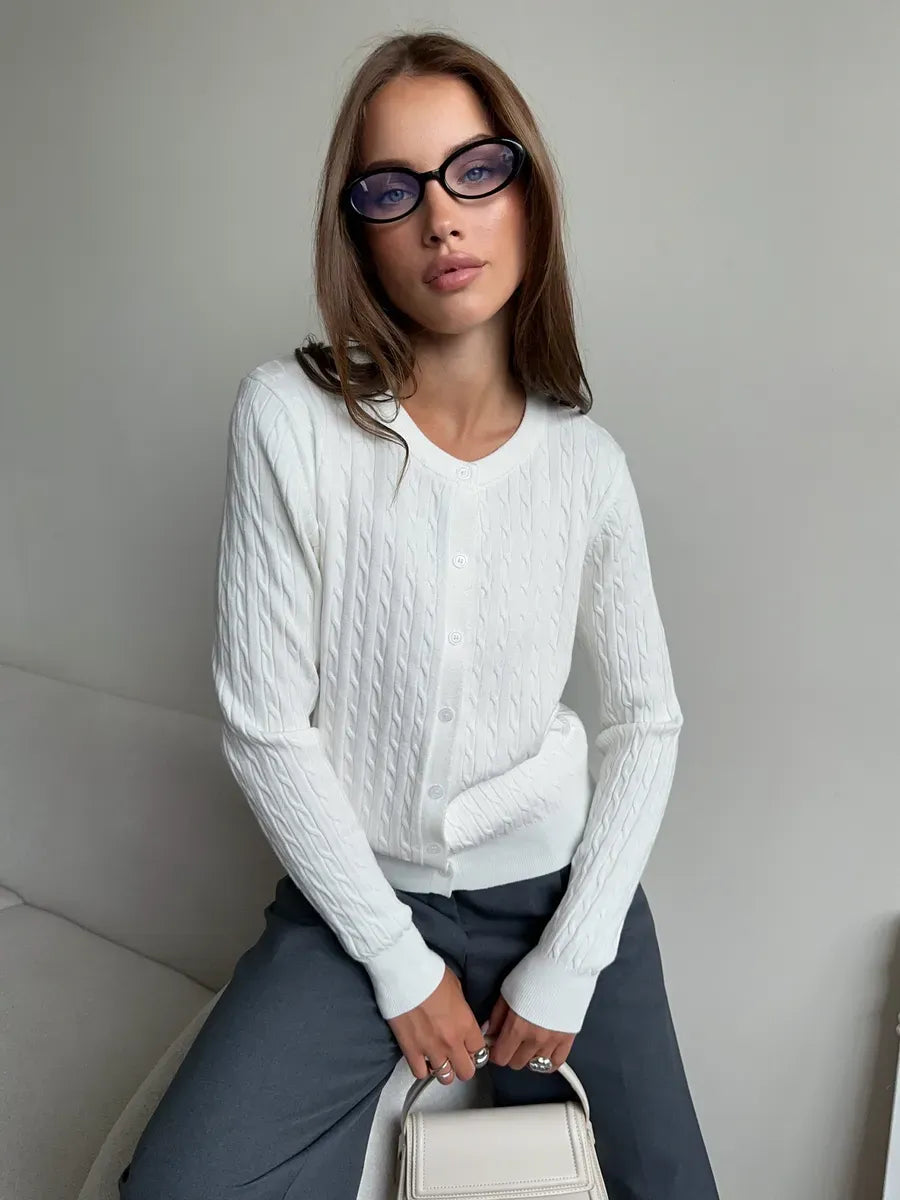 Model wearing Ivory Cardigan by Lauven, a lightweight cable knit viscose blend sweater, showcasing elegance and comfort.