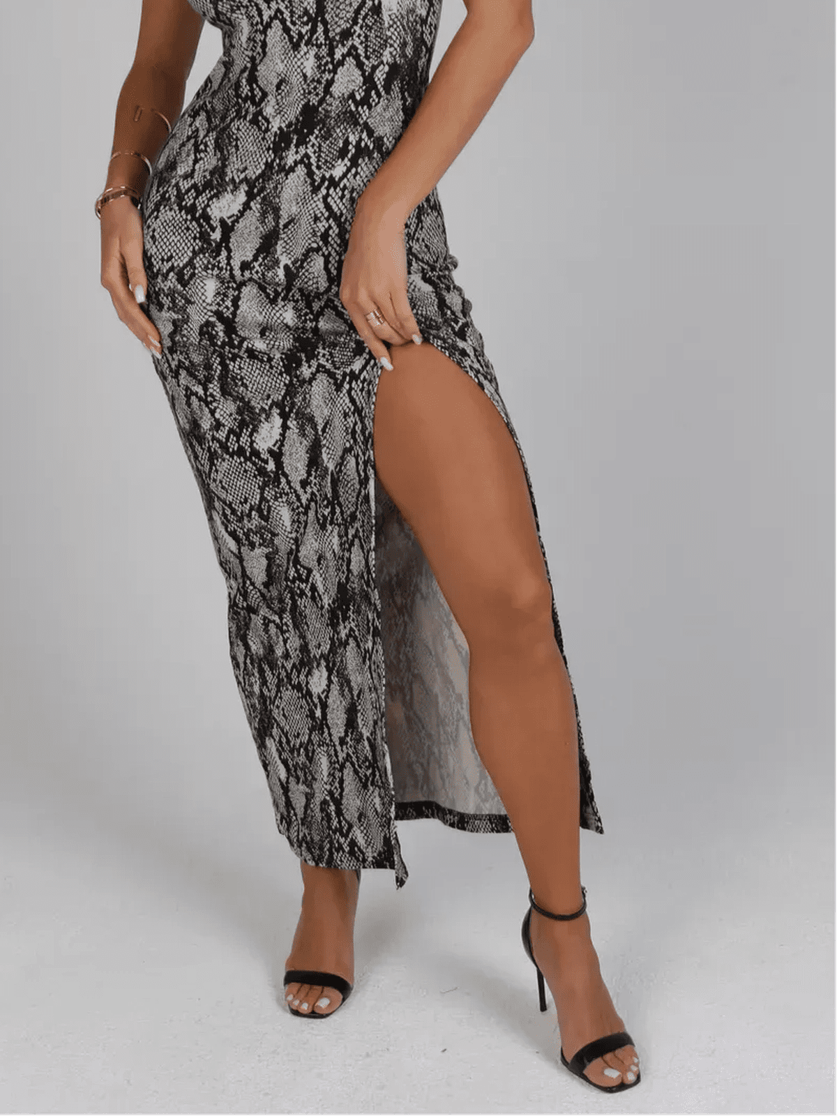 Nerine Maxi Dress by Lauven featuring a bold snakeskin print and elegant side slit for a chic silhouette.