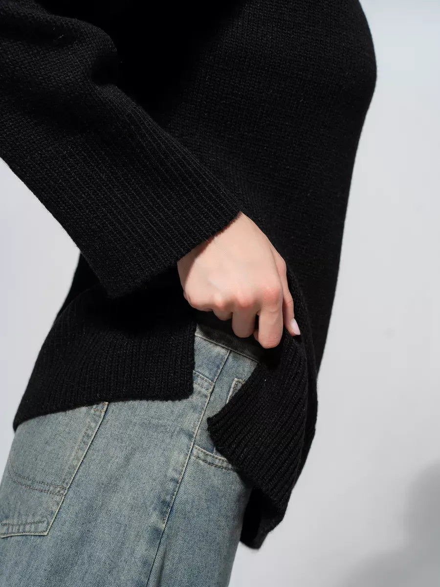 Onyx Sweater by Lauven, oversized black knitwear featuring a side slit detail, ideal for casual layering.
