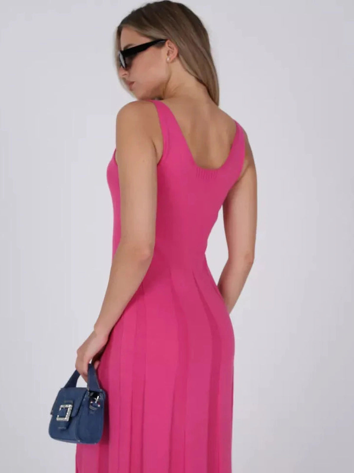 Lyra Maxi Dress by Lauven, women's fuchsia knit dress with A-line silhouette, showcasing stylish back and soft ribbed texture.