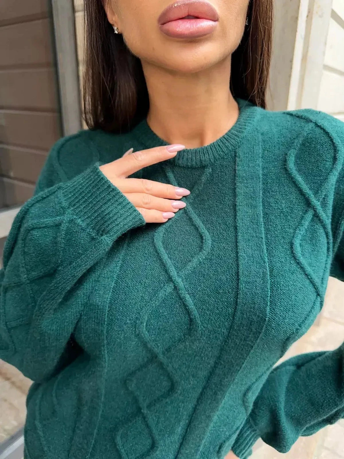 Elegant textured knit detail from the Selene Midi Dress by Lauven in emerald green.