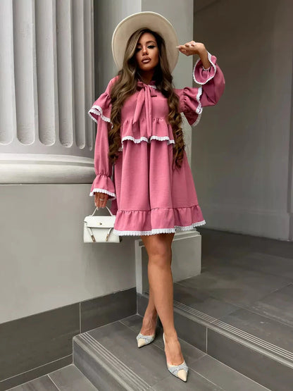 Rosea Mini Dress by Lauven, featuring elegant ruffles and lace detail in a stylish pink hue.