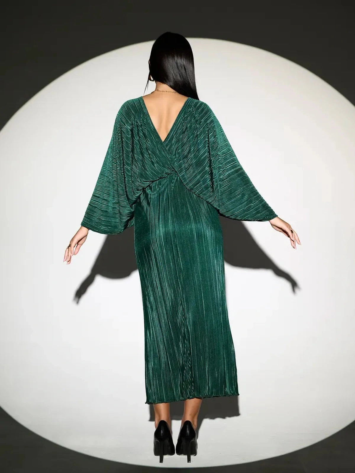 Astra Midi Dress by Lauven, emerald pleated dress showcasing an elegant flowing silhouette from the back.