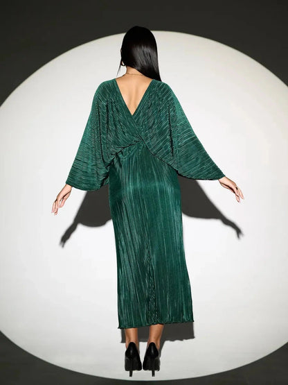 Astra Midi Dress by Lauven, emerald pleated dress showcasing an elegant flowing silhouette from the back.