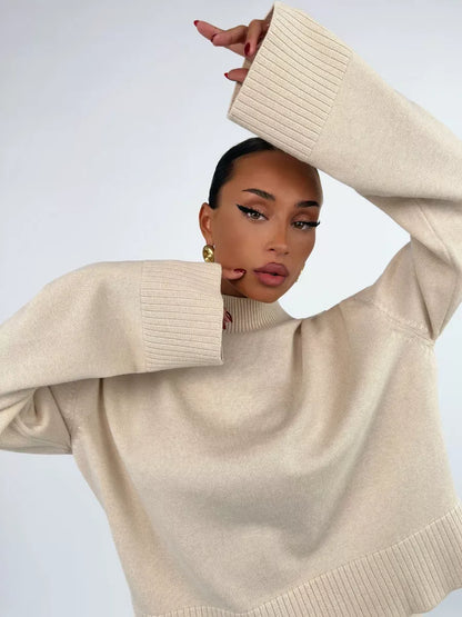 Eterna Sweater by Lauven in light beige, showcasing an oversized design and elegant knit texture.