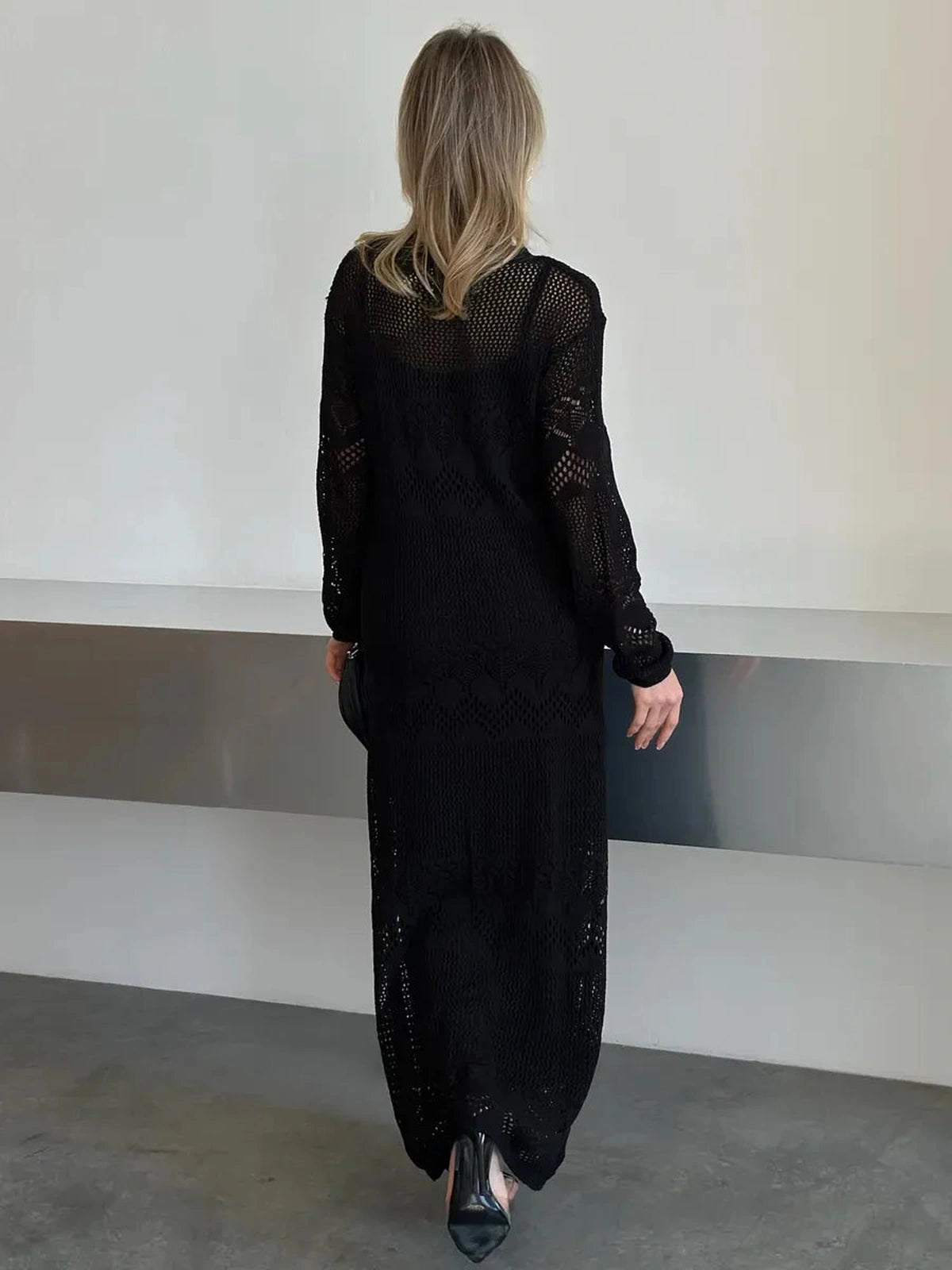 Lunara Maxi Dress by Lauven showcasing elegant black crochet knit from the back view.