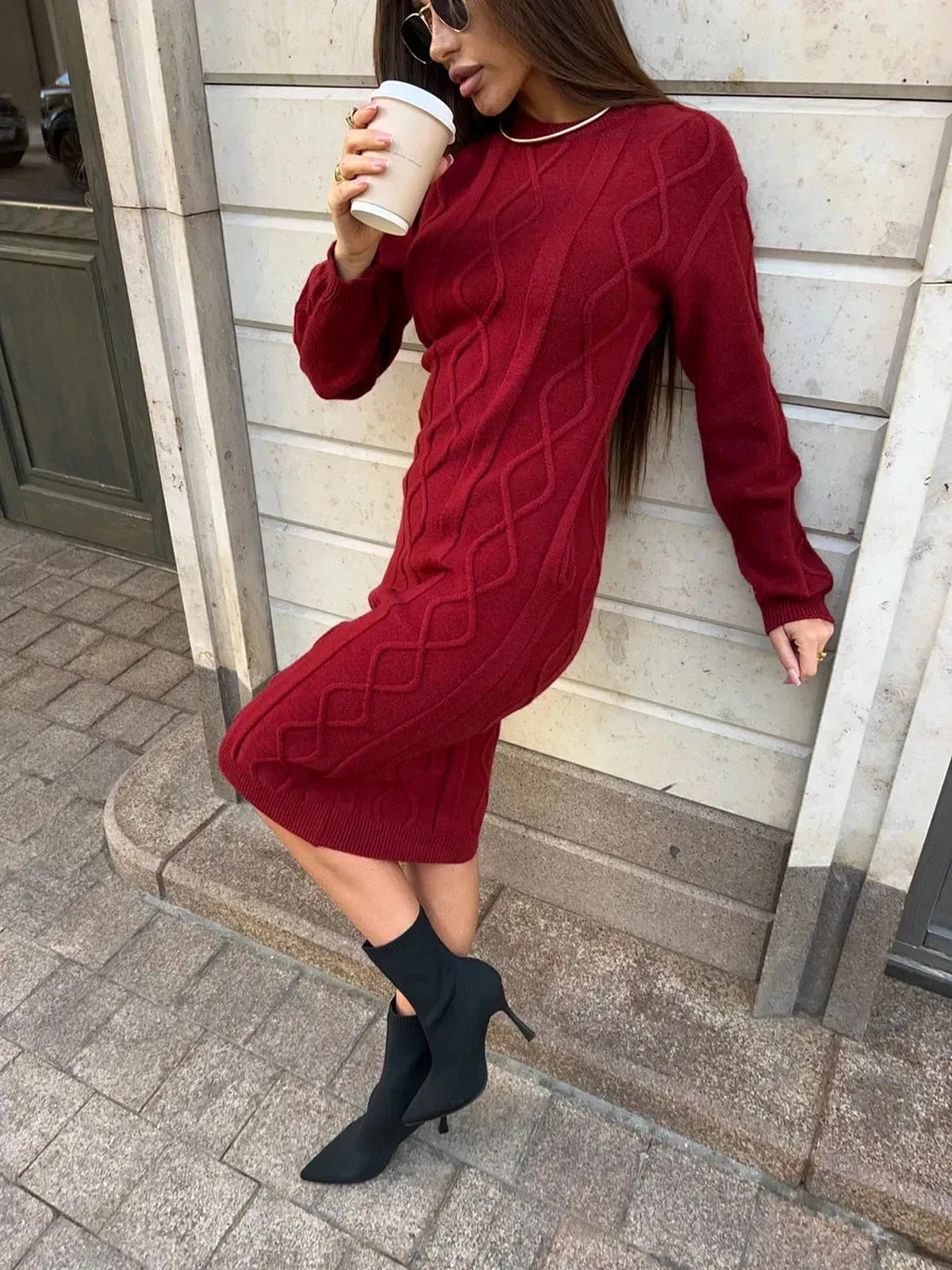 Model in a Crimson Midi Dress by Lauven, showcasing its elegant texture and cozy design for autumn.