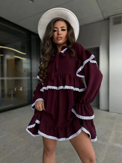 Marina Mini Dress by Lauven featuring burgundy color, lace trims, and ruffle details for effortless elegance.