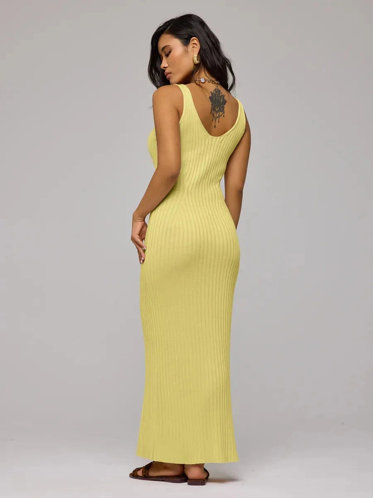 Soleil Maxi Dress by Lauven, elegant yellow ribbed knit dress showcasing a back view.