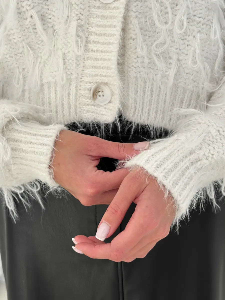 Ivory Cardigan by Lauven, featuring feathered fringe and cozy bouclé knit detail, perfect for stylish layering.