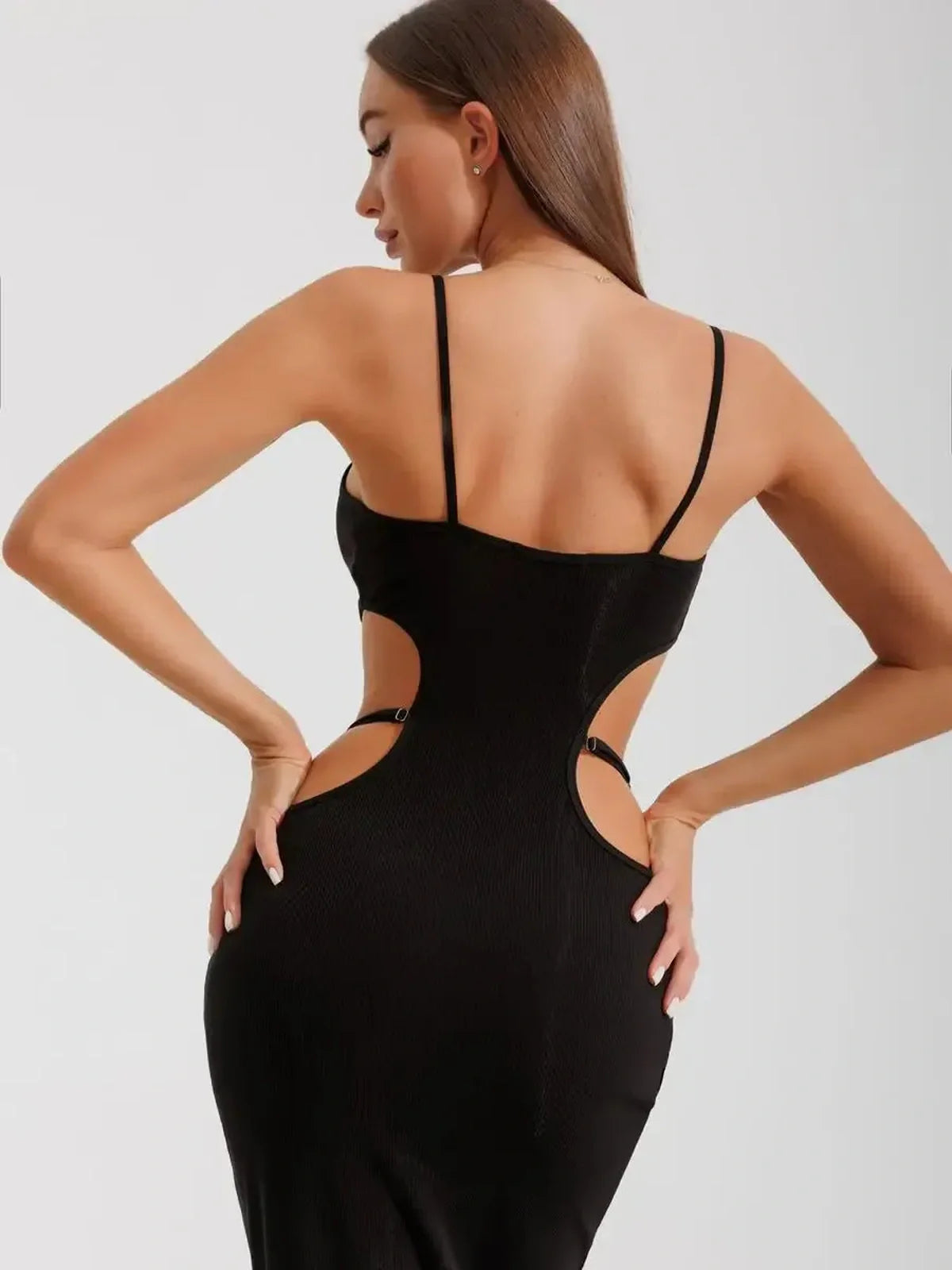 Back view of the Midnight Silhouette Midi Dress showcasing its curve-hugging cutouts and fitted design.