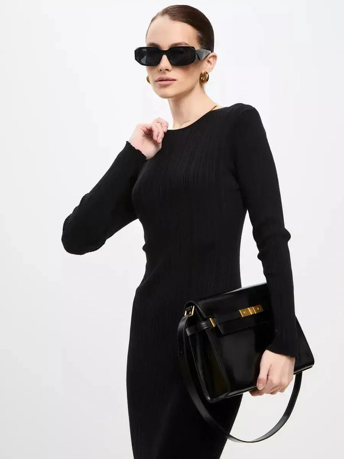Sculpted Rib Maxi Dress styled with sunglasses and a chic black handbag, showcasing a streamlined silhouette.