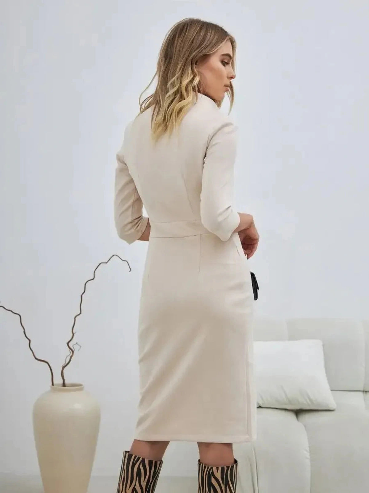 Sedona Mini Dress by Lauven, showcasing minimalist zip-front elegance from the back, in a soft sculpted silhouette.