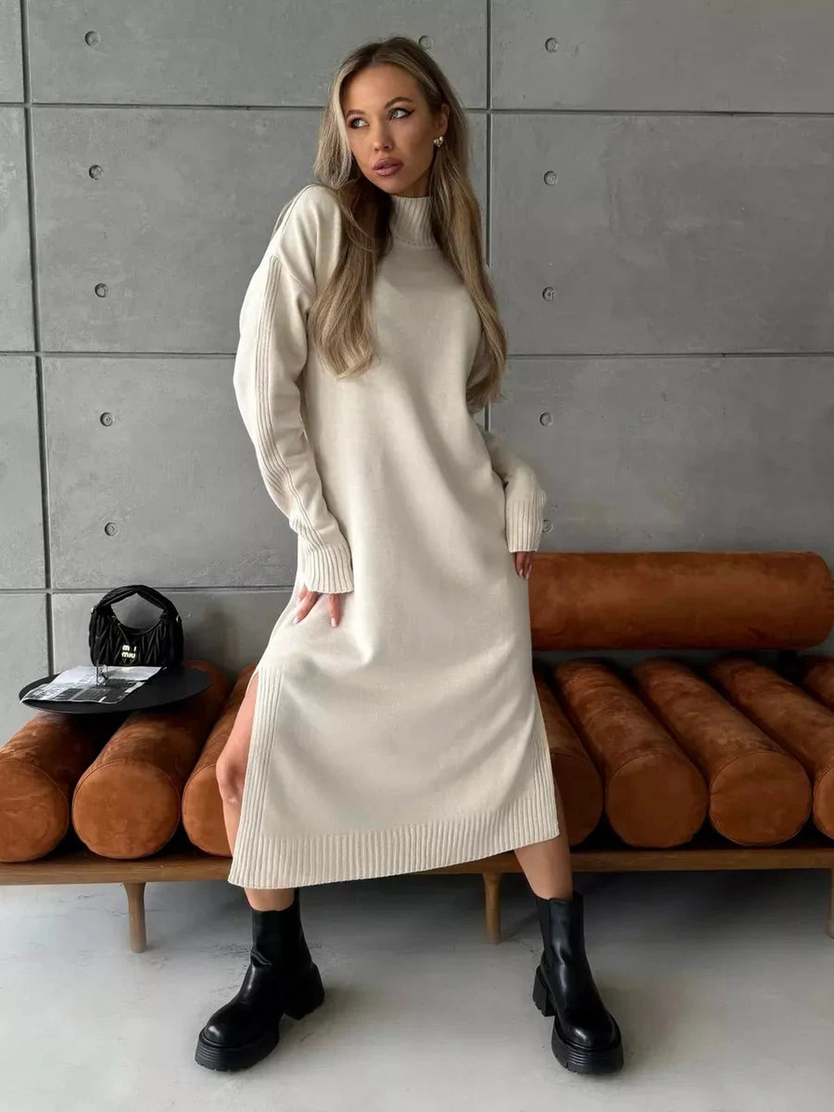 Celeste Midi Dress by Lauven, elegant knit design in soft beige worn with stylish black ankle boots.