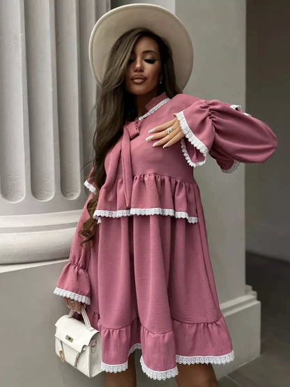 Rosea Mini Dress by Lauven, featuring elegant ruffles and lace detail, embodying feminine sophistication.