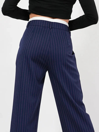 Aster Pants featuring a refined high-waist wide-leg silhouette in elegant navy pinstripes by Lauven.