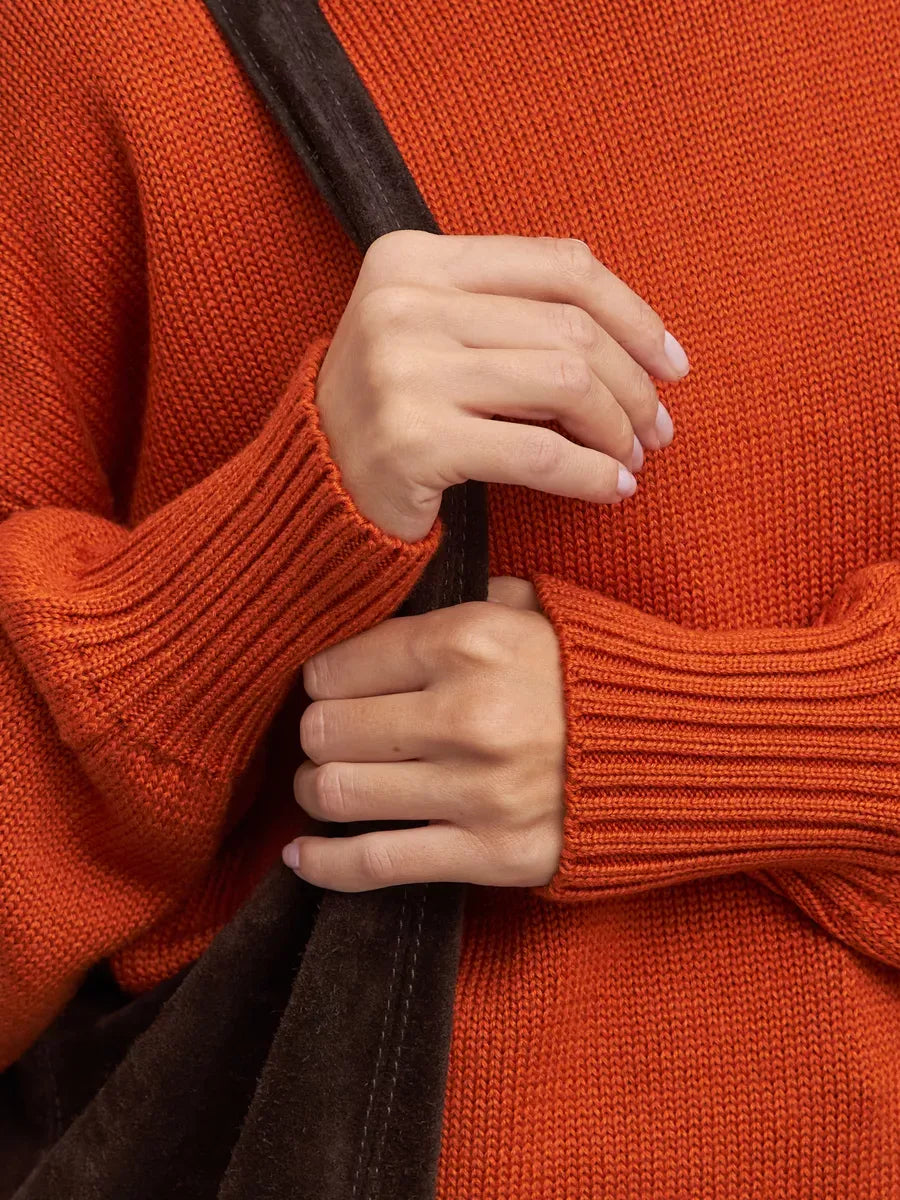 Ember Sweater by Lauven, oversized women’s wool knit turtleneck in terracotta color, showcasing cozy details.