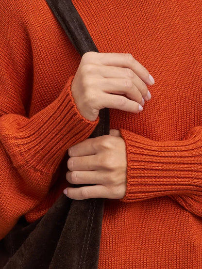 Ember Sweater by Lauven, oversized women’s wool knit turtleneck in terracotta color, showcasing cozy details.