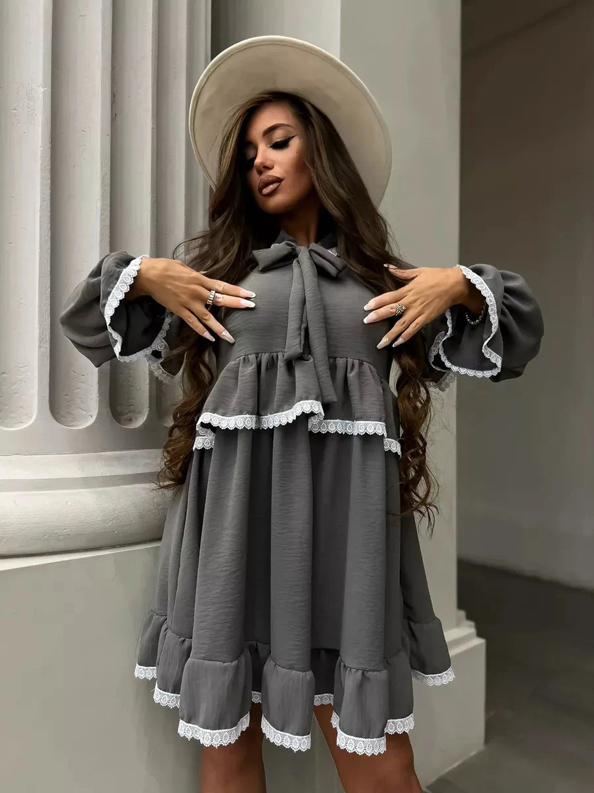 Luna Mini Dress by Lauven featuring elegant ruffled design and lace trim in a stylish gray color.