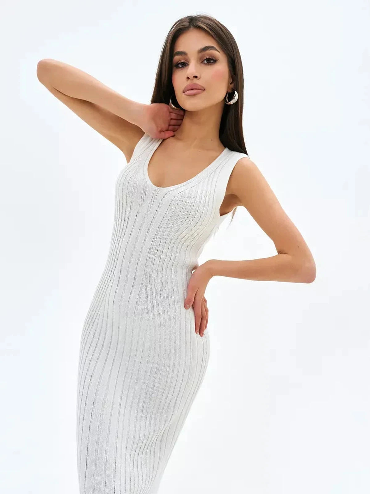 Aria Midi Dress by Lauven, a sleeveless ivory ribbed knit dress showcasing a flattering V-neckline and elegant silhouette.