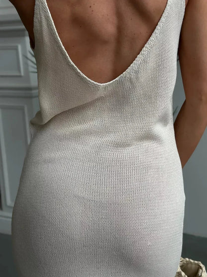 Back view of a model in the Lunara Maxi Dress by Lauven, featuring a deep scoop neckline and soft knit texture.