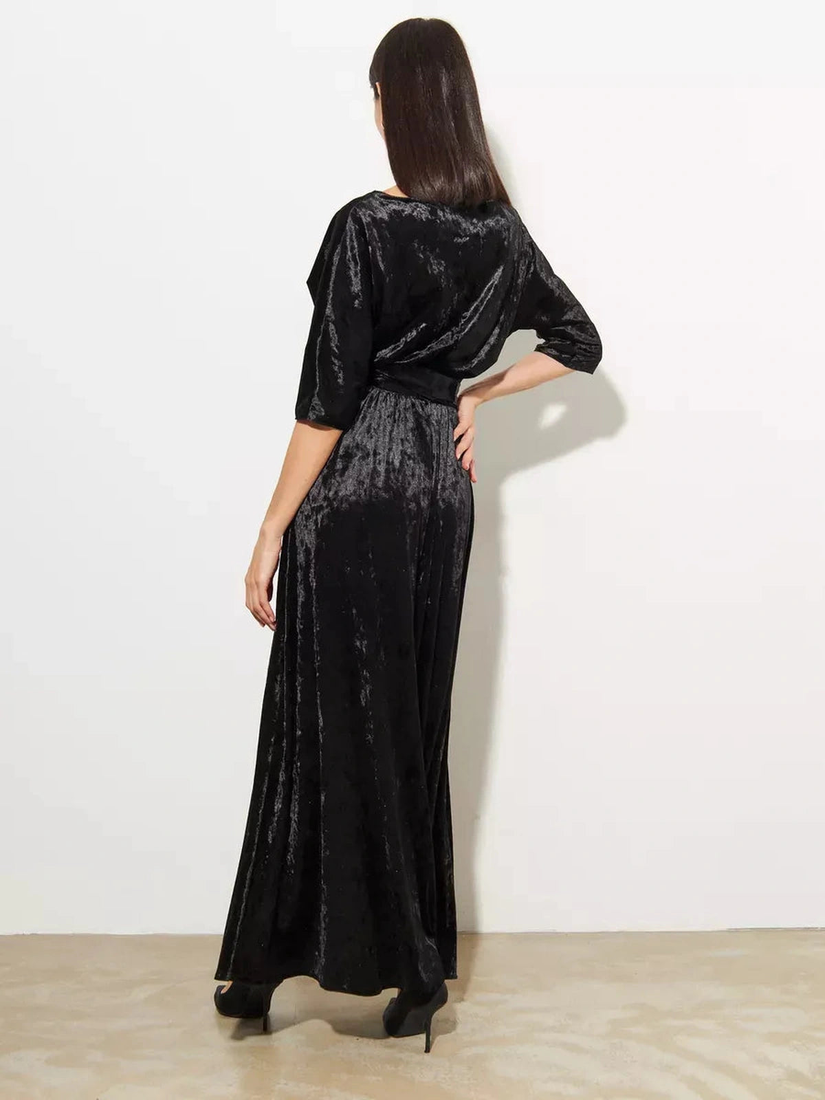 Elegant back view of the Noiré Maxi Dress by Lauven, showcasing the luxurious black velvet A-line design.