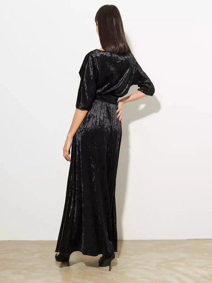 Elegant back view of the Noiré Maxi Dress by Lauven, showcasing the luxurious black velvet A-line design.
