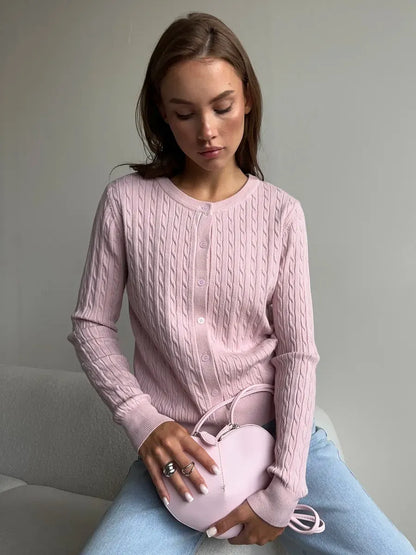 Rosewood Cardigan in lightweight pink viscose, featuring cable knit detail, styled with a pastel handbag by Lauven.