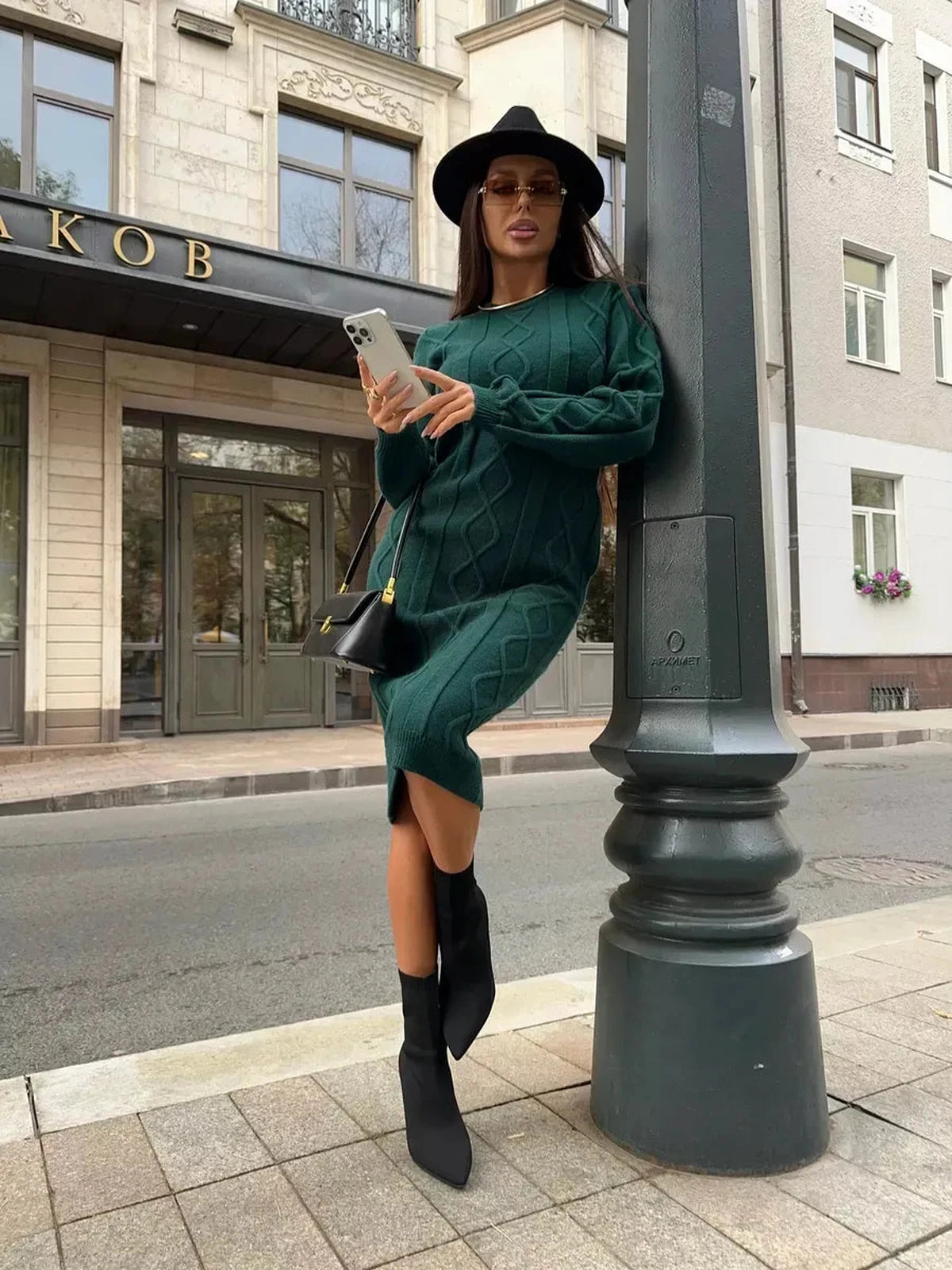 Selene Midi Dress by Lauven, elegant textured knit dress in emerald worn with stylish accessories.