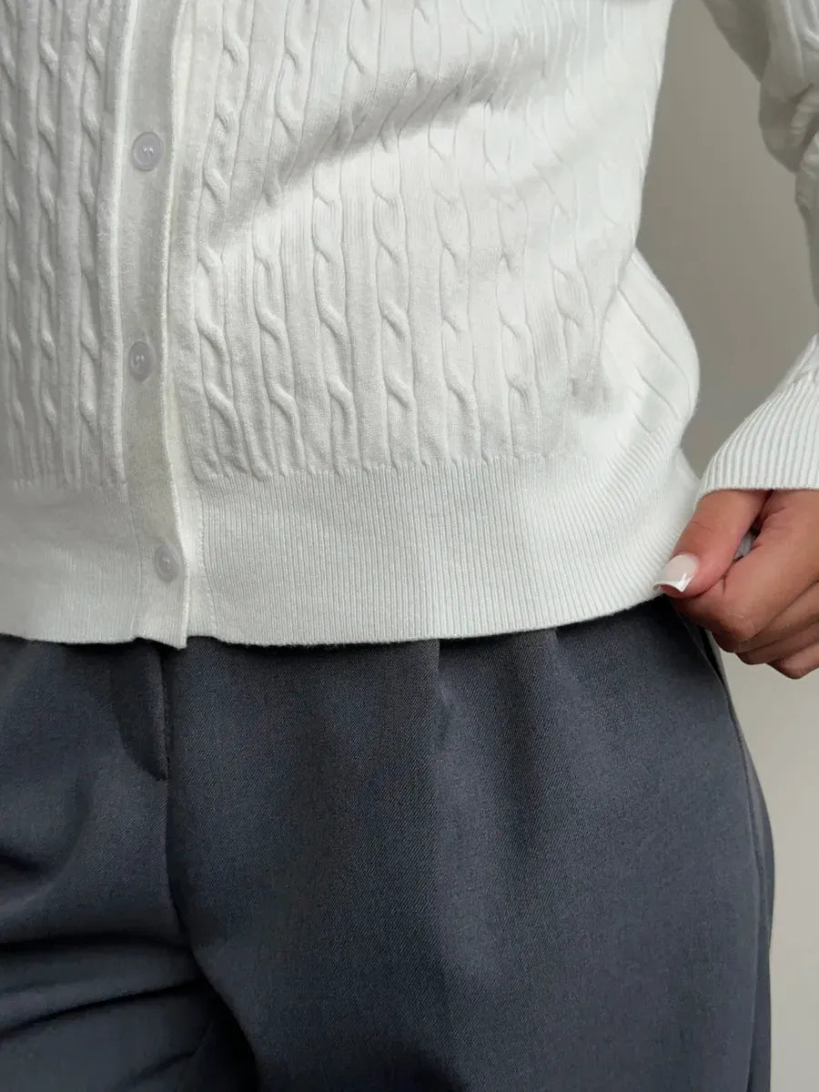 Ivory Cardigan by Lauven, showcasing lightweight cable knit texture and stylish fit with buttons and ribbed details.