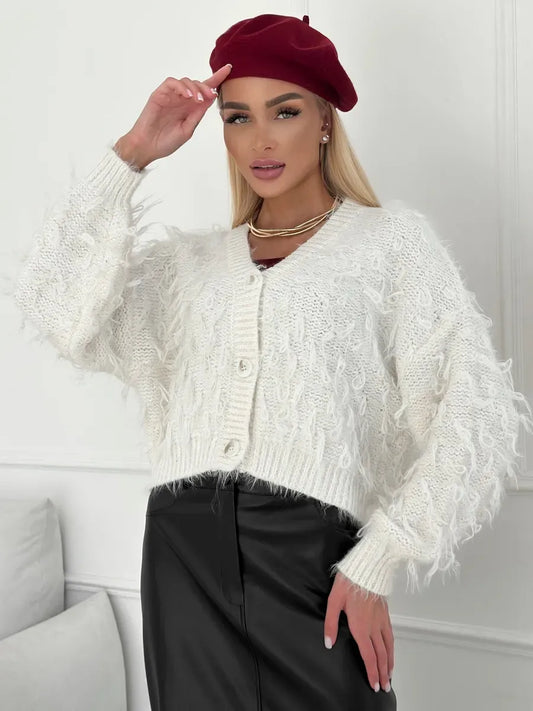 Ivory Cardigan by Lauven, cropped oversized bouclé knit with feathered fringe, styled with a red beret.