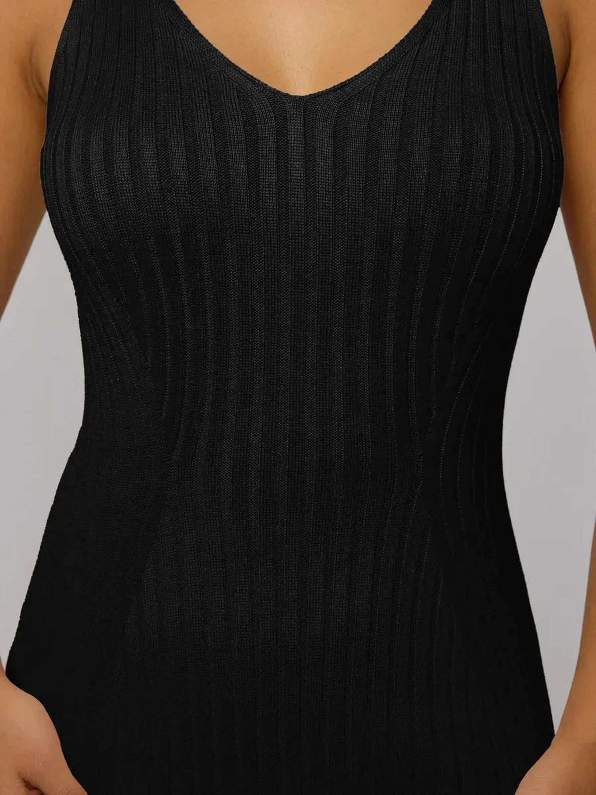 Close-up of the Noir Maxi Dress by Lauven, showcasing the sleek black ribbed knit design and flattering fit.
