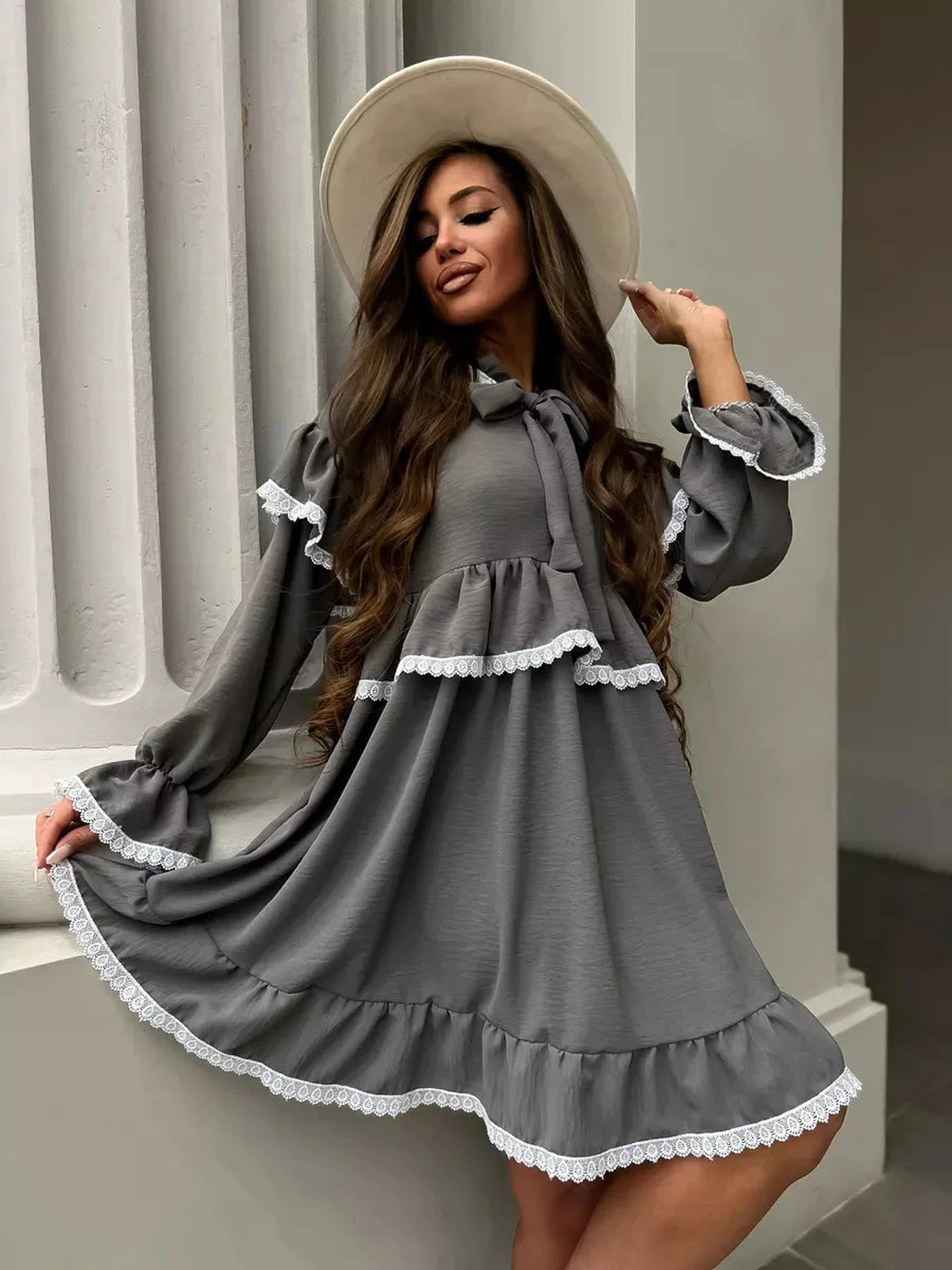 Lauven Luna Mini Dress featuring elegant ruffled design and lace trim, perfect for stylish occasions.