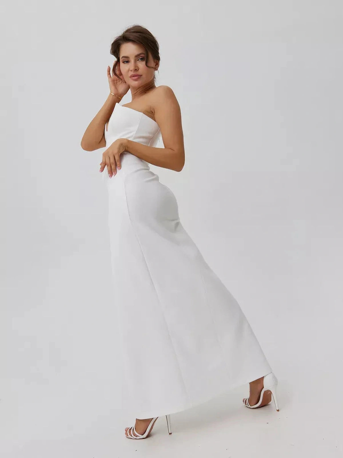 Lunaria Maxi Dress by Lauven, showcasing a minimalist design with a sculpted fit and elegant front slit in white.