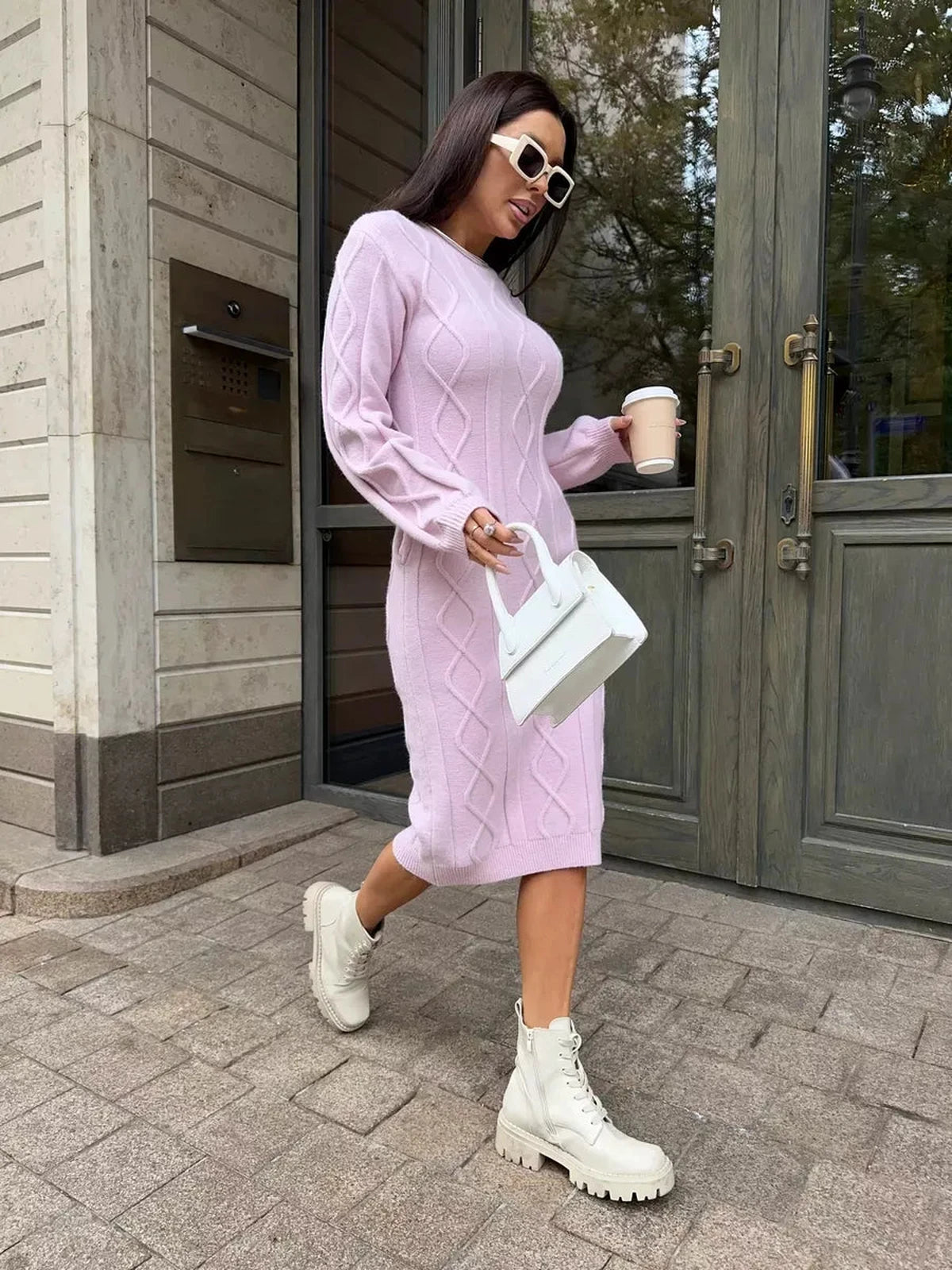 Luna Midi Dress by Lauven – Textured knit sweater dress in soft flamingo pink worn with stylish boots.