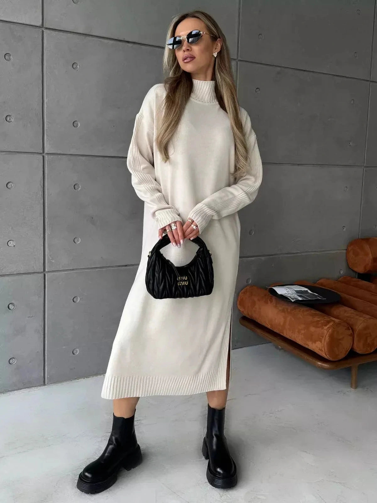 Celeste Midi Dress by Lauven, featuring a soft beige knit design, high neckline, and relaxed silhouette.