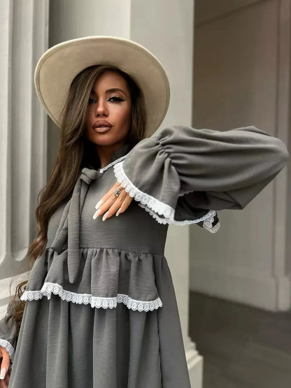 Luna Mini Dress by Lauven features an elegant ruffled design and lace trim, perfect for stylish occasions.