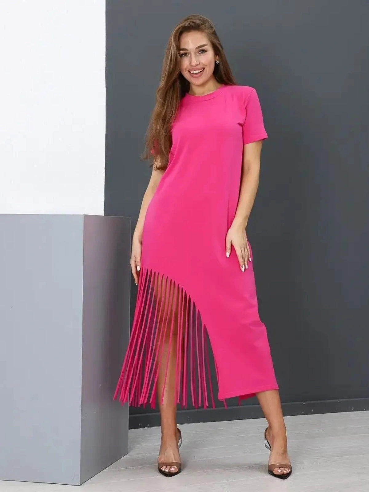 Capri Midi Dress by Lauven in fuchsia with fringe hem, showcasing a bold and elegant silhouette.
