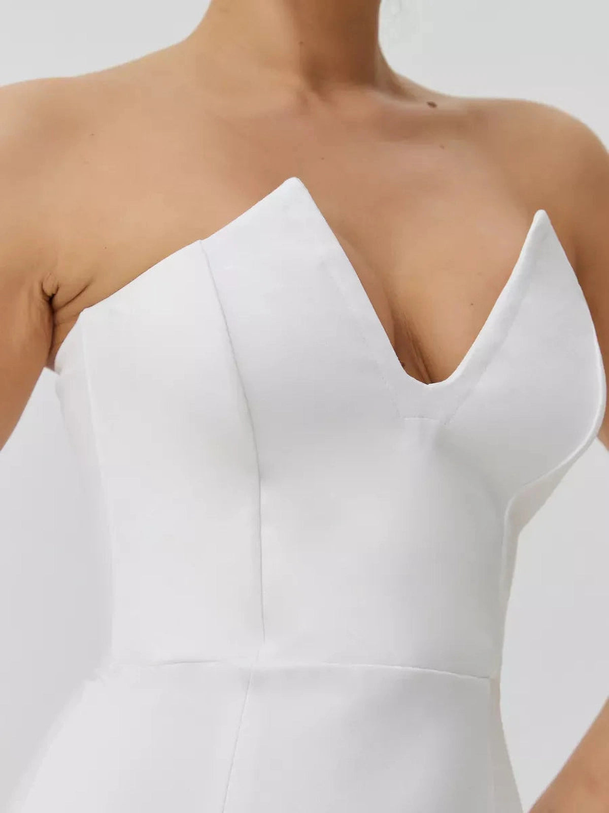 Lunaria Maxi Dress by Lauven, showcasing a minimalist white design with a corset-inspired bodice and sculpted fit.