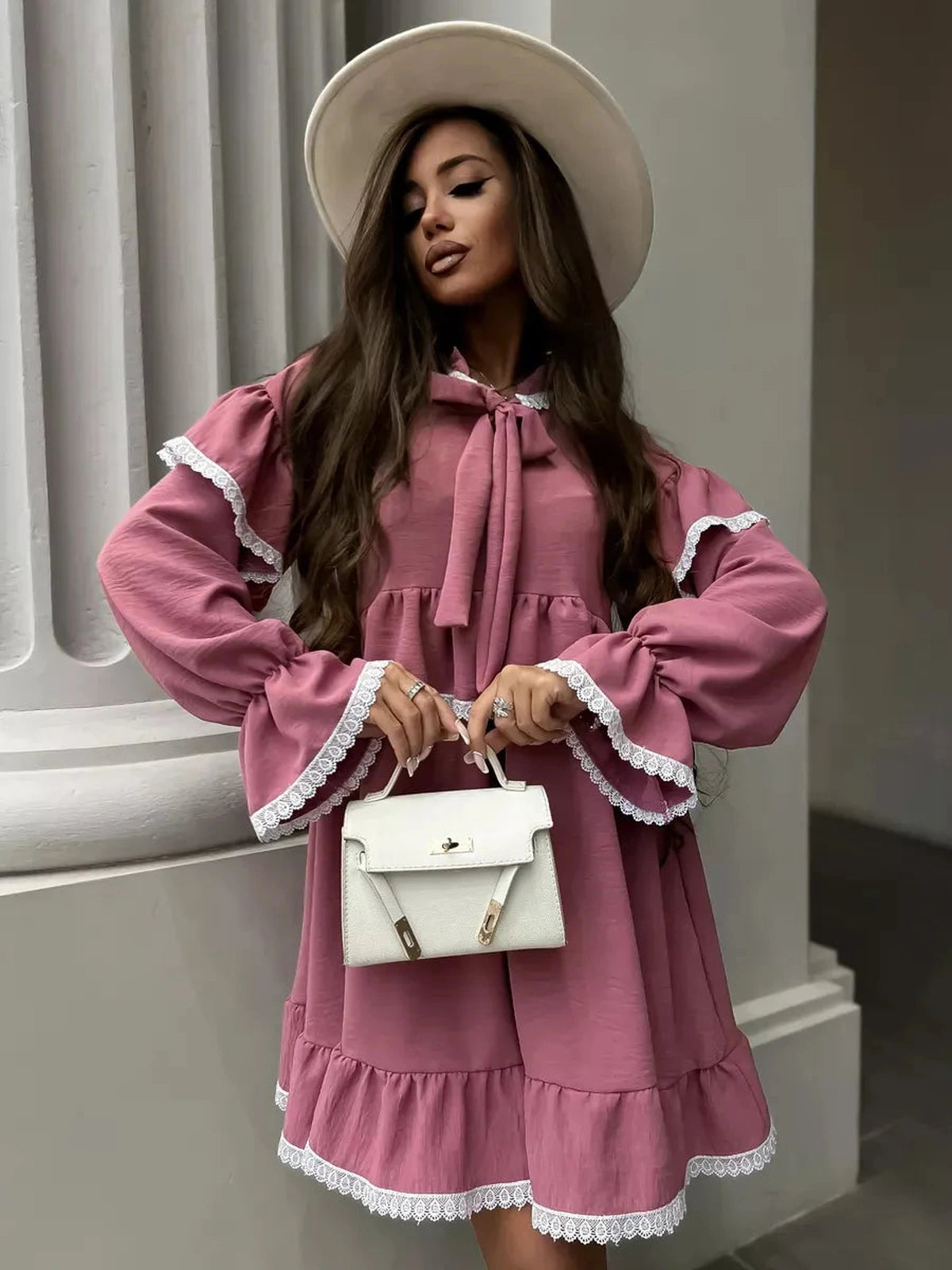 Rosea Mini Dress by Lauven featuring elegant ruffles, lace detail, and stylish accessories.