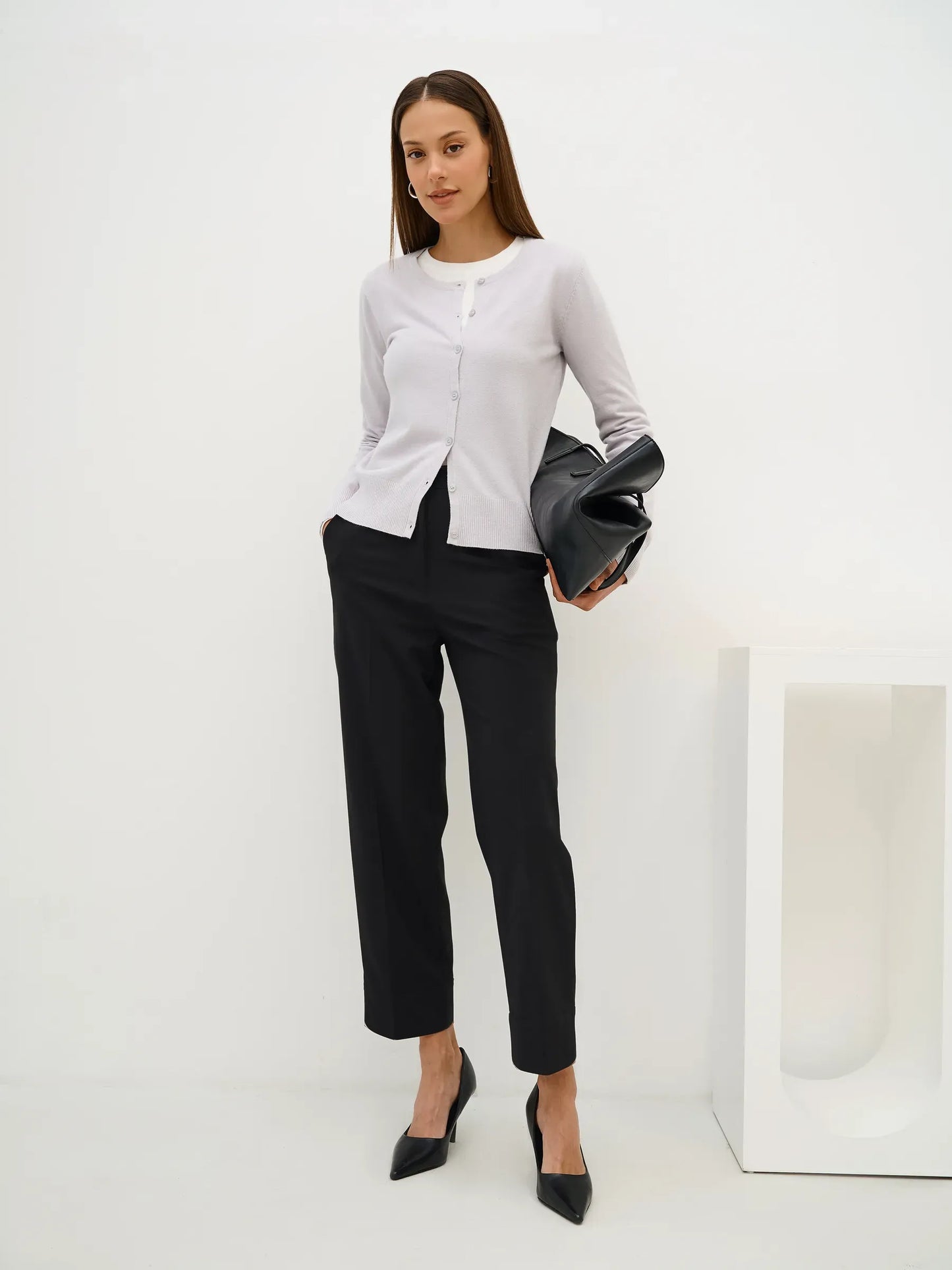 Luna Cardigan styled with black trousers, showcasing soft grey knitwear from Lauven, perfect for elegant casual wear.