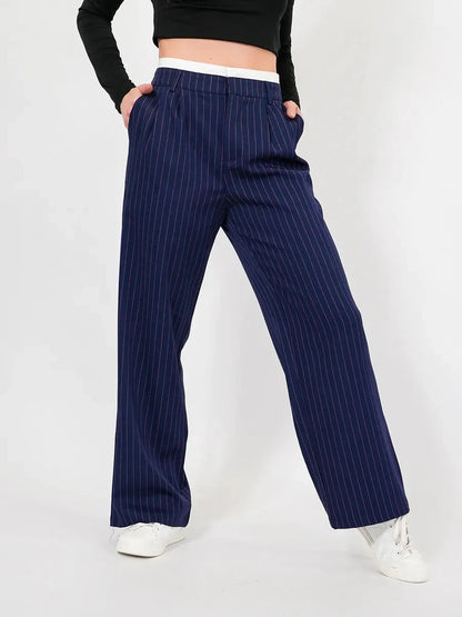 Aster Pants by Lauven feature a high-waist wide-leg silhouette in elegant navy pinstripes for women.
