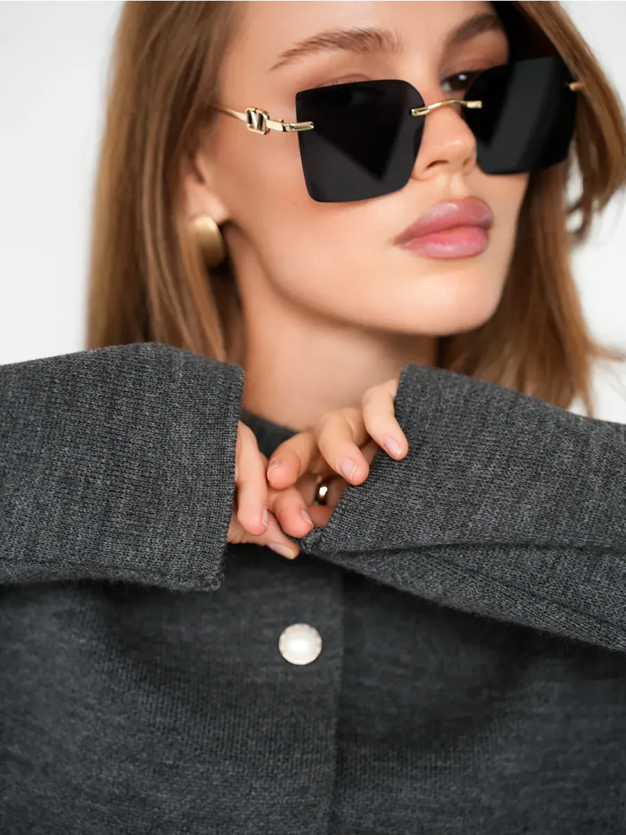 Asher Cardigan in warm graphite, stylish knitwear by Lauven, featuring button closure and worn with trendy sunglasses.