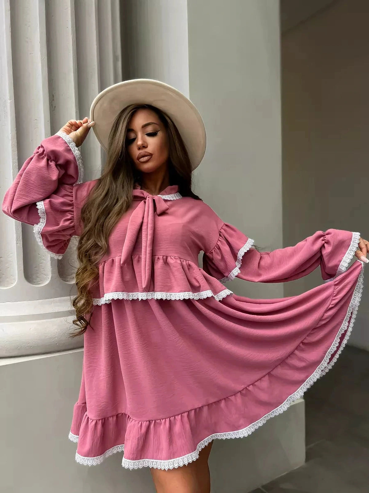 Rosea Mini Dress by Lauven with elegant ruffles and lace detail, showcasing feminine sophistication in a pink hue.