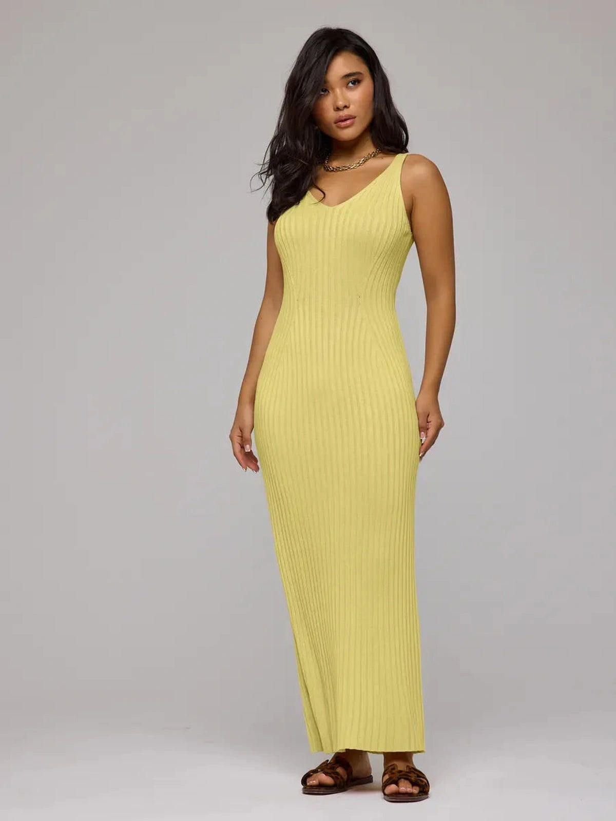 Soleil Maxi Dress by Lauven in vibrant yellow ribbed knit showcasing a sleek silhouette and elegant design.
