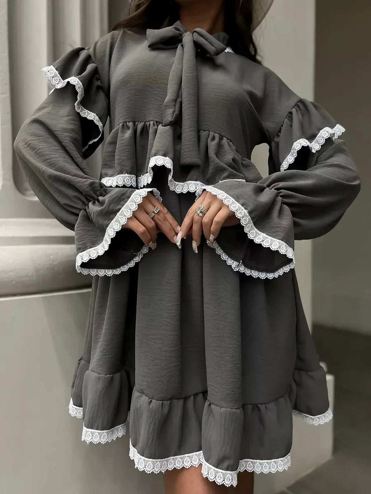 Luna Mini Dress by Lauven featuring elegant ruffled design and lace trim, perfect for stylish occasions.